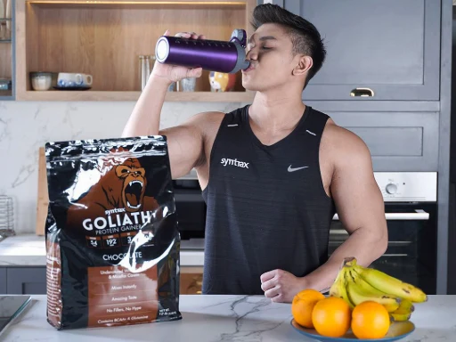 A man drinking a Goliath Chocolate shake